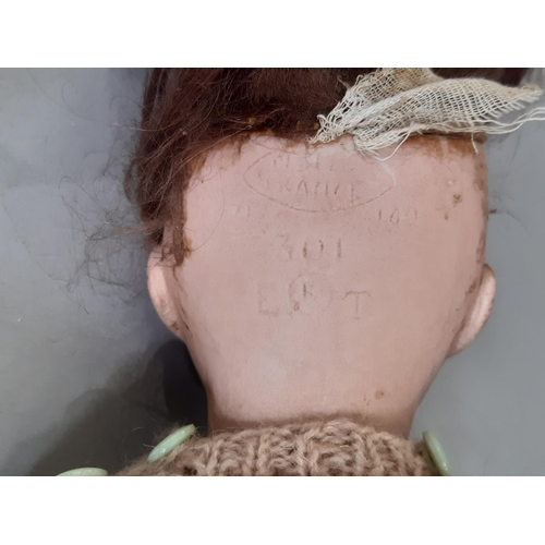 277 - SFBJ interest; early 20th century bisque head doll, impressed marks 'UNIS FRANCE 301' and 'E (R in a... 