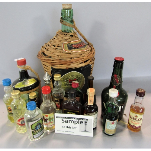 1674 - A mixed selection of alcoholic drinks, a bottle Cava, bottles of wine and some open half full spirit... 