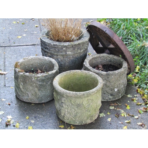 2005 - Four small weathered cast composition stone garden circular planters of varying size and design with... 