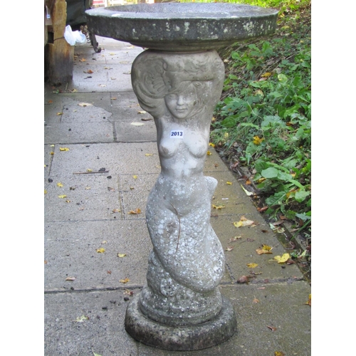 2013 - A weathered cast composition stone two sectional bird bath, the pedestal in the form of a mermaid su... 