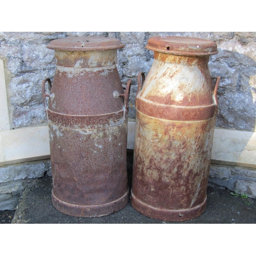 2020 - Two weathered vintage heavy gauge milk churns and caps with loop handles, Cadbury's Bros Ltd and CWS... 