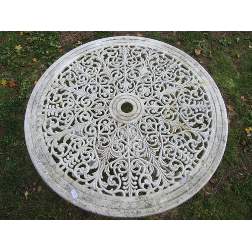 2029 - A cream painted cast aluminium garden terrace table with decorative circular pierced top, 67 cm diam... 