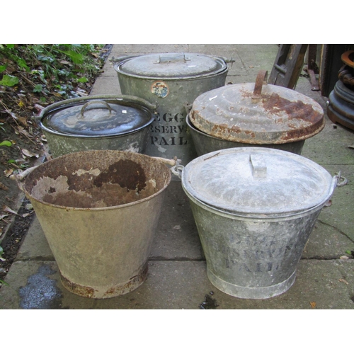 2034 - A vintage galvanised egg preserving pail together with four further galvanised pails/brackets of var... 