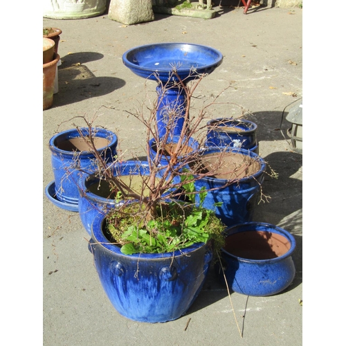 2036 - A collection of contemporary blue glazed planters of varying size and design