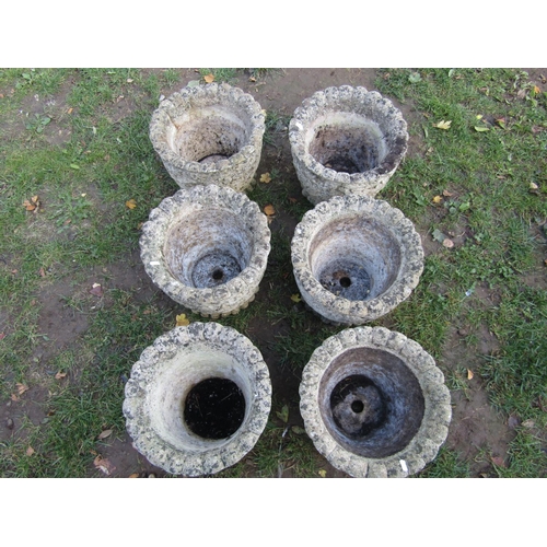 2044 - A set of six weathered cast composition stone garden planters of circular form with repeating acorn ... 