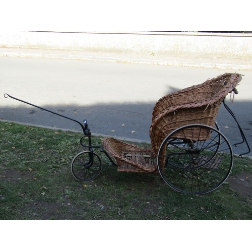 2052 - A Victorian bath chair with sprung seat, wire spoke wheels, hard rubber tyres (basket seat for recom... 