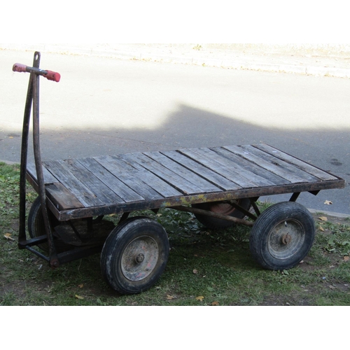 2053 - A useful vintage four wheeled platform hand cart/trolley with slatted wooden bed, the bed 153 cm (5f... 