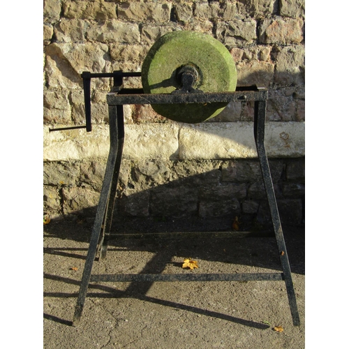 2058 - An old well-used sharpening stone on an iron stand with winding handle