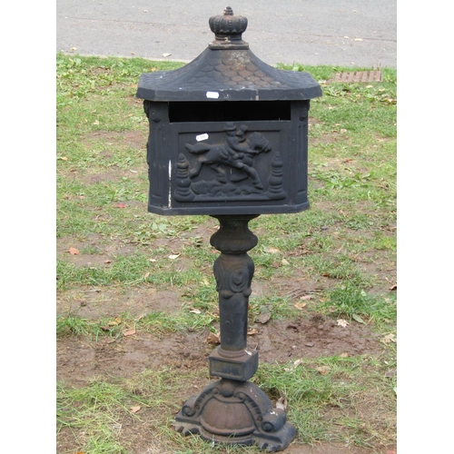 2061 - A reproduction cast iron freestanding post box with simulated tiled roof, crown finial, 1 metre high... 