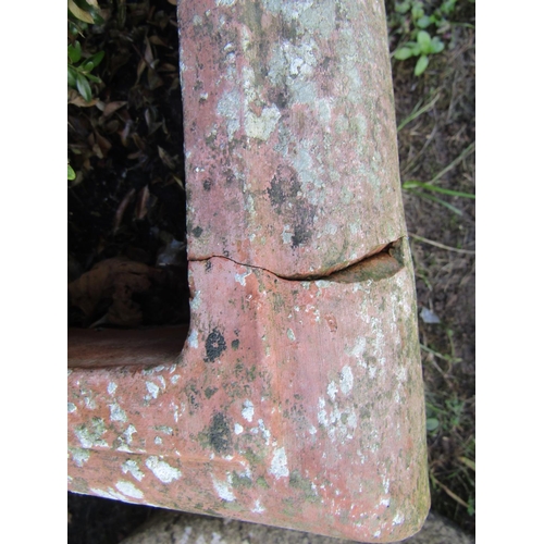 2073 - A pair of weathered terracotta planters of square tapered form with stepped and moulded rims contain... 