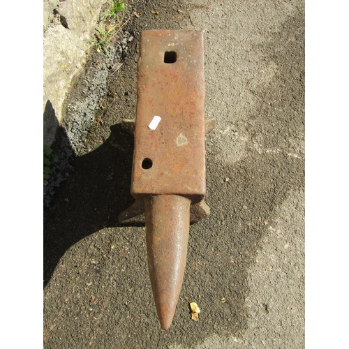 2086 - A small but heavy cast iron anvil with two cut out/pierced receptacles, 48cm long x 24cm high