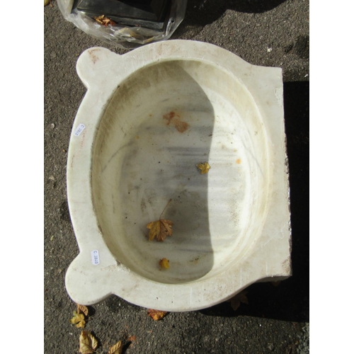 2089 - An old white marble and grey veined basin of oval form with pronounced lugs, approx 50cm wide x 40cm... 