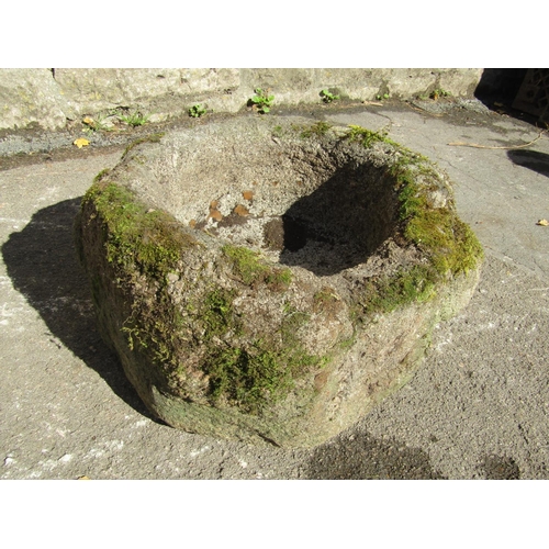 2097 - An early weathered carved natural stone mortar, octagonal, with pronounced lugs, 40cm across x 24cm ... 