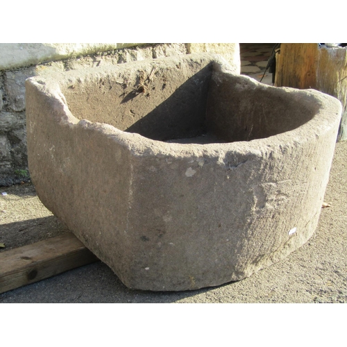 2108 - A weathered natural stone D shaped trough, 56cm wide x 54cm deep x 30cm high