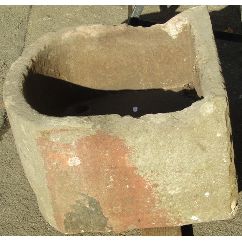 2108 - A weathered natural stone D shaped trough, 56cm wide x 54cm deep x 30cm high