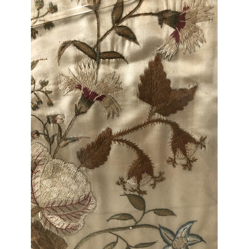 81 - Silk embroidery depicting a basket of flowers on cream silk satin (19th century or earlier) oval fra... 