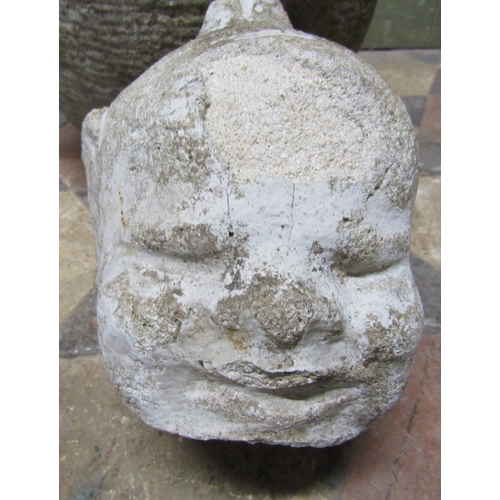 2111 - A small weathered hand carved natural stone mortar, with turreted lugs, 30cm diameter approx x 16cm ... 