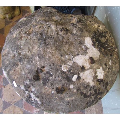 2114 - A weathered natural stone staddlestone, with domed cap, 56cm diameter x 60cm high (af)