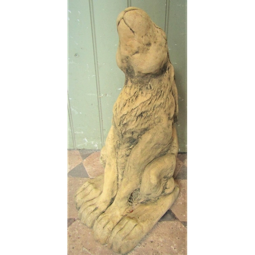 2124 - A weathered buff coloured composition stone seated hare 47 cm high