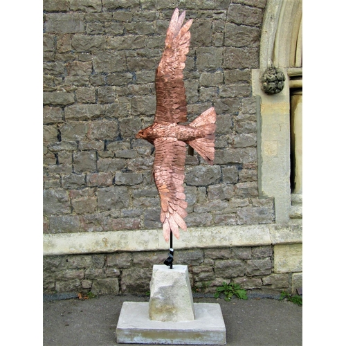 2145 - A life size sculpture/study of a red kite in flight by Bob Rowley mounted and set within a stone bas... 