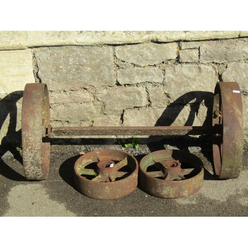 2158 - Two pairs of antique cast iron spoke implement wheels 38 cm and 25 cm in diameter, a pair weathered ... 