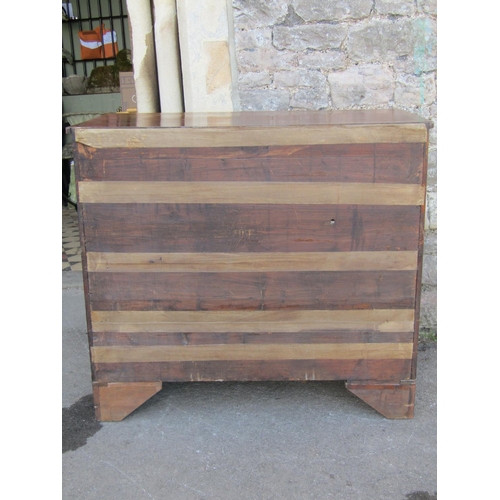 2227 - A Georgian mahogany bedroom chest of two short over three long graduated drawers with ebony stringin... 