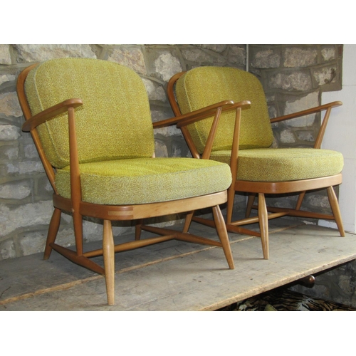 2253 - A pair of vintage light Ercol low Windsor style hoop and stick back open elbow chairs