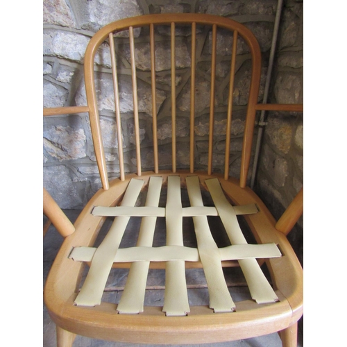 2253 - A pair of vintage light Ercol low Windsor style hoop and stick back open elbow chairs