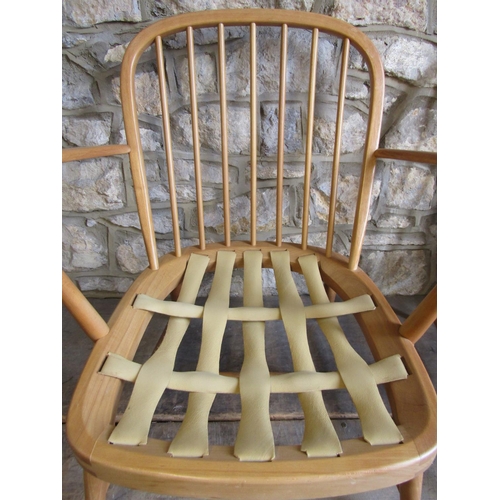 2253 - A pair of vintage light Ercol low Windsor style hoop and stick back open elbow chairs