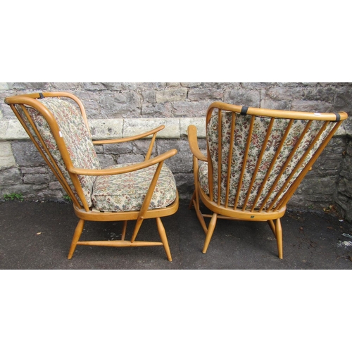 2257 - A pair of vintage light Ercol stick back down swept open armchairs