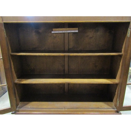 2262 - An early 20th century oak side cabinet, freestanding and enclosed by two pairs of panelled doors, th... 