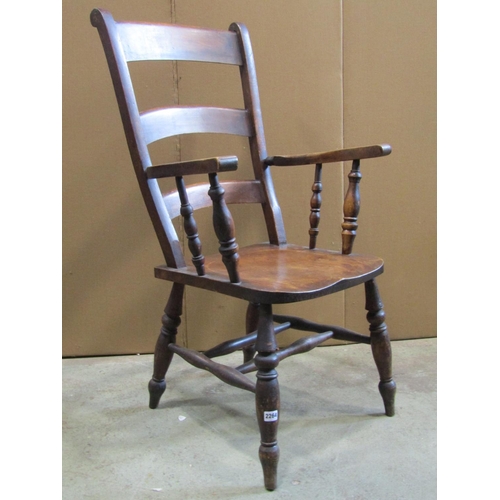 2264 - A 19th century stained Windsor triple bar back elbow chair with saddle shaped seat