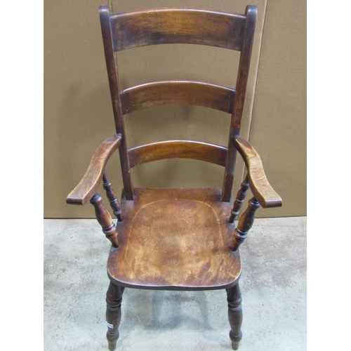 2264 - A 19th century stained Windsor triple bar back elbow chair with saddle shaped seat