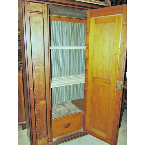 2283 - A Victorian gothic revival pitch pine wardrobe with inlaid detail, enclosed by full length central m... 