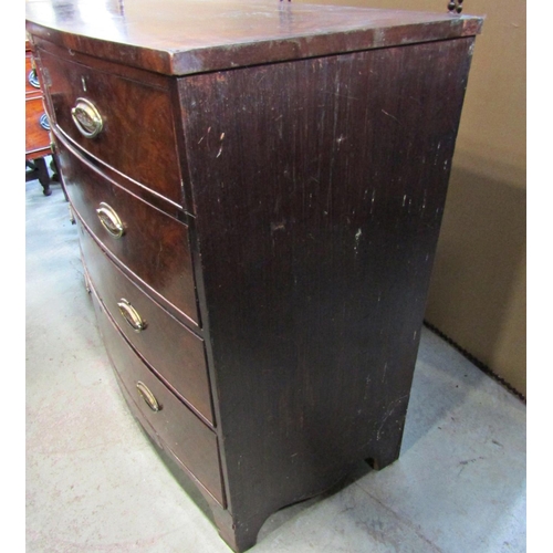 2286 - A Georgian mahogany and stained oak sided bow fronted bedroom chest of two short over three long gra... 