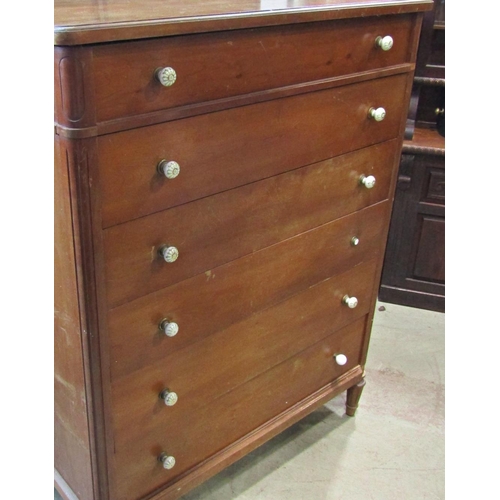 2288 - A fruitwood chest of six long graduated drawers raised on turned, tapered and fluted supports, 108 c... 