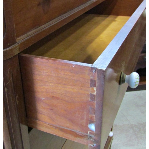 2288 - A fruitwood chest of six long graduated drawers raised on turned, tapered and fluted supports, 108 c... 