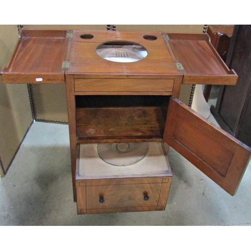 2291 - A Georgian mahogany washstand of square cut form with hinged top revealing cut out bowl receptacles ... 