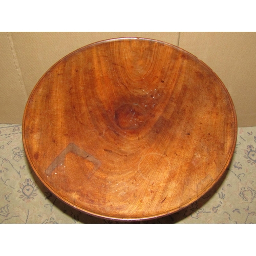 2312 - A 19th century mahogany tray top occasional table of circular form raised on a turned pillar and tri... 