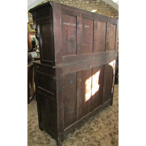 2328 - An antique old English style oak court cupboard, enclosed by two pairs of panelled doors with expose... 