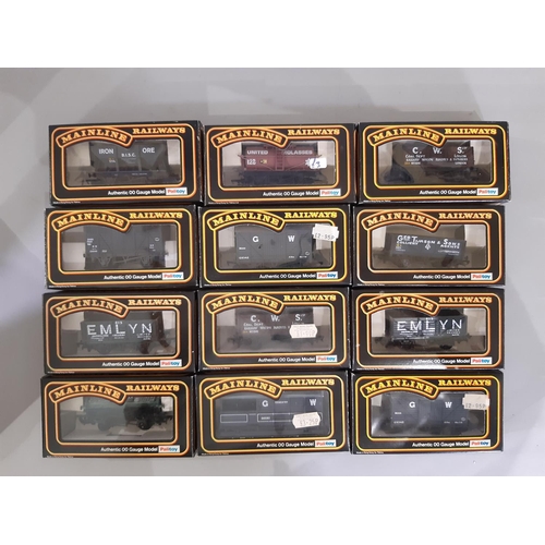 342 - 24 boxed 00 gauge models by Mainline comprising various wagons and vans including 37-172 GWR Bogie B... 