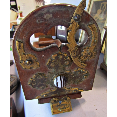 1680 - A patent Betjeman's oak adjustable book slide, (as found), an oak desk top adjustable calendar, a ta... 