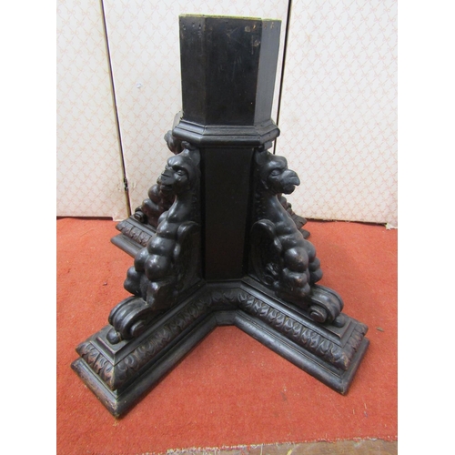 2639 - Victorian oak octagonal column pedestal, supported by four carved winged creatures, 66cm high