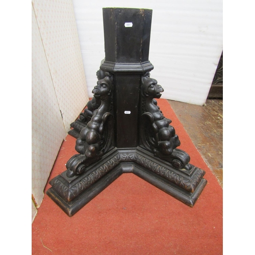 2639 - Victorian oak octagonal column pedestal, supported by four carved winged creatures, 66cm high