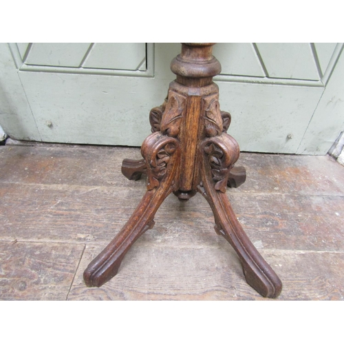 2654 - A Victorian gothic revival octagonal occasional table, the top inlaid with mahogany, with carved col... 