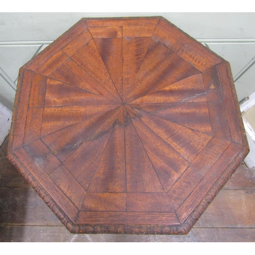 2654 - A Victorian gothic revival octagonal occasional table, the top inlaid with mahogany, with carved col... 