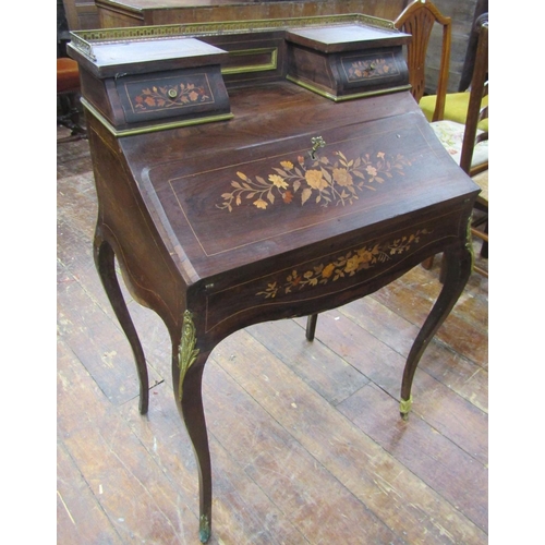 2657 - A 19th century rosewood Bonheur De Jour, the fall flap enclosing a simply fitted interior, on shaped... 