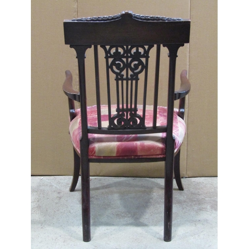 2353 - An Edwardian mahogany open elbow chair in the Georgian style, with pierced and scrolled splat and in... 