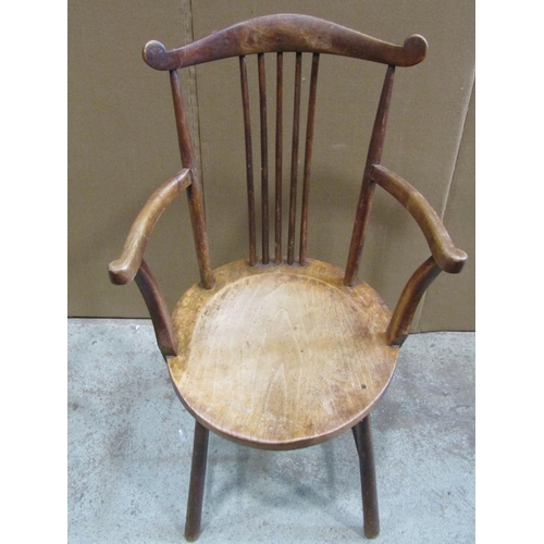 2378 - An Edwardian stick back open elbow chair with circular dished seat