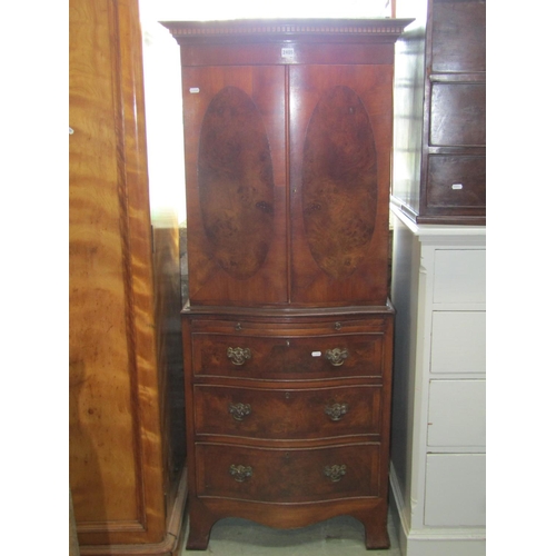 2405 - A small reproduction side cabinet in the Georgian style, in two sections with serpentine front, the ... 